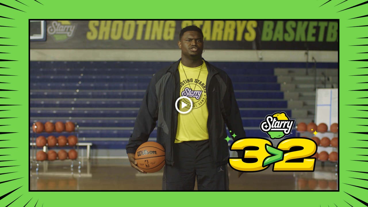 Shooting Starry's Basketball Camp film still with a player holding basketballs
